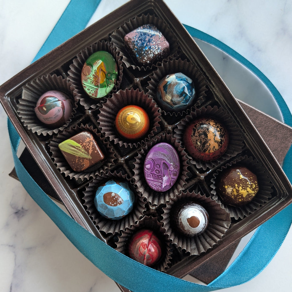 Box of colorful chocolates on a marble surface